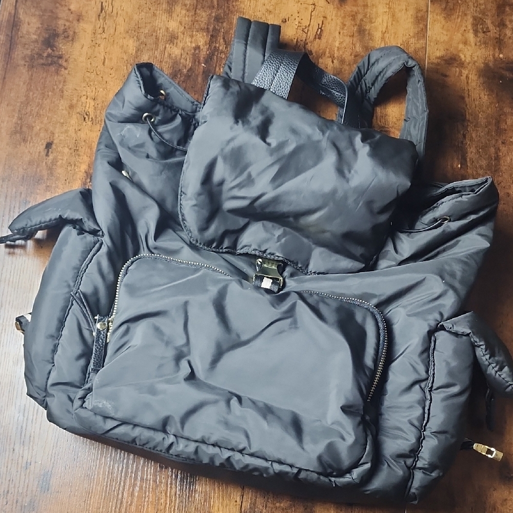 TOMMY BAHAMA | Black Puffer Backpack With Drawstring, Side Pockets, Gold Accents